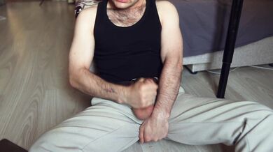Young muscular guy with tattoos relaxes and fucks himself in tight pants
